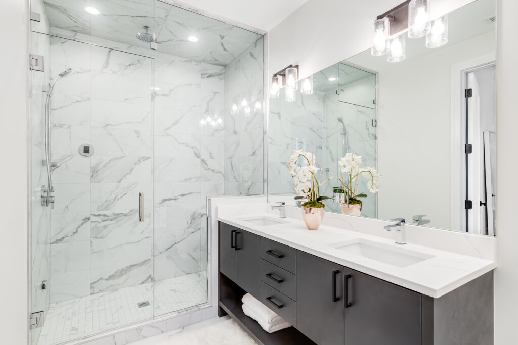 Newly remodeled modern bathroom with marble shower. 